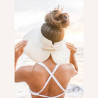Aili's Corner large brim bow beach hat in white, perfect for sun protection at the beach.