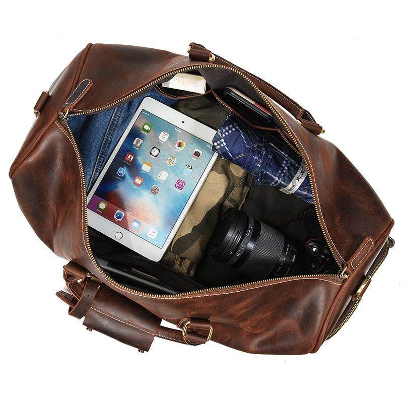 Large leather weekend bag with spacious interior for clothes, tablet, and camera gear
