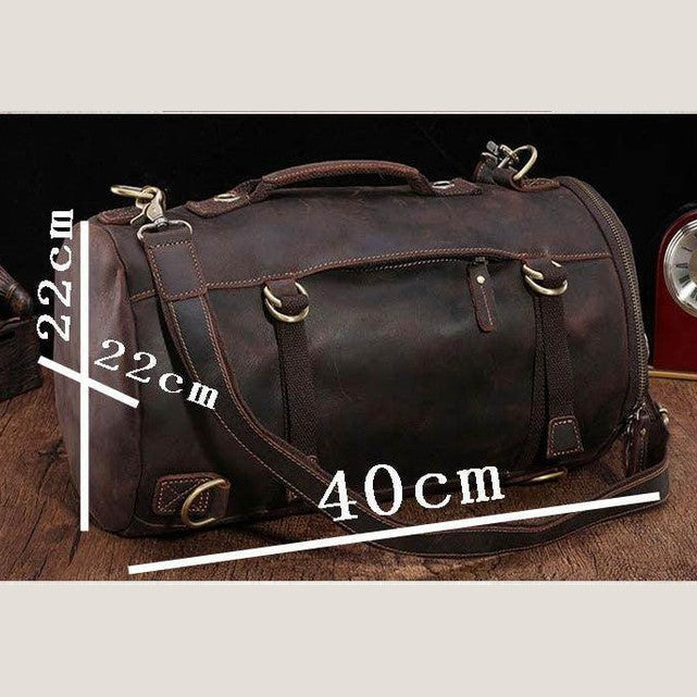 Large travel bag for men in brown leather with sturdy handles and adjustable shoulder strap for travel convenience