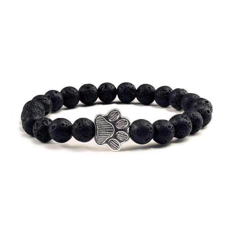 Lava stone pet bracelet with a silver paw charm, perfect for pet lovers and casual wear