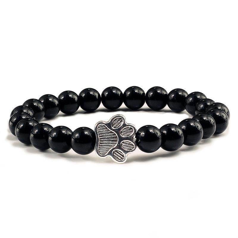 Lava stone pet bracelet for men featuring a silver paw print charm on a stylish beaded design