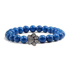 Lava stone pet bracelet in blue with a stylish paw print charm for pet lovers