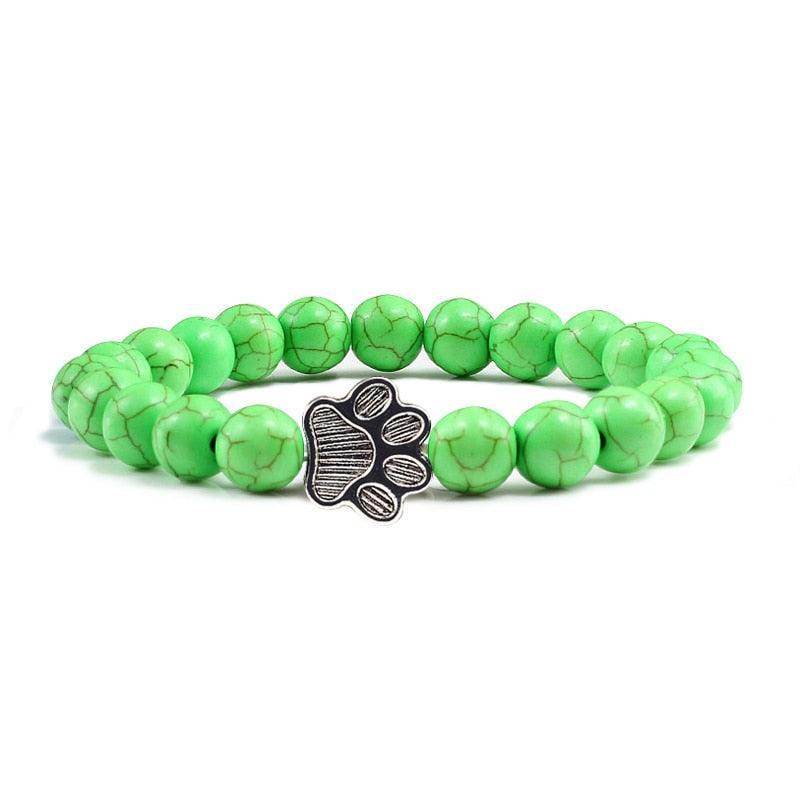 Lava stone pet bracelet with green beads and a stylish paw charm for pet lovers