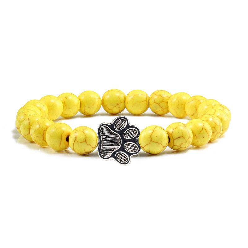 VacationGrabs lava stone pet bracelet with yellow beads and a paw print charm for pet lovers