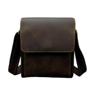 Durable brown leather briefcase for professionals with adjustable shoulder strap and classic design