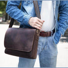 Brown leather briefcase for professionals with adjustable strap, perfect for business and daily use