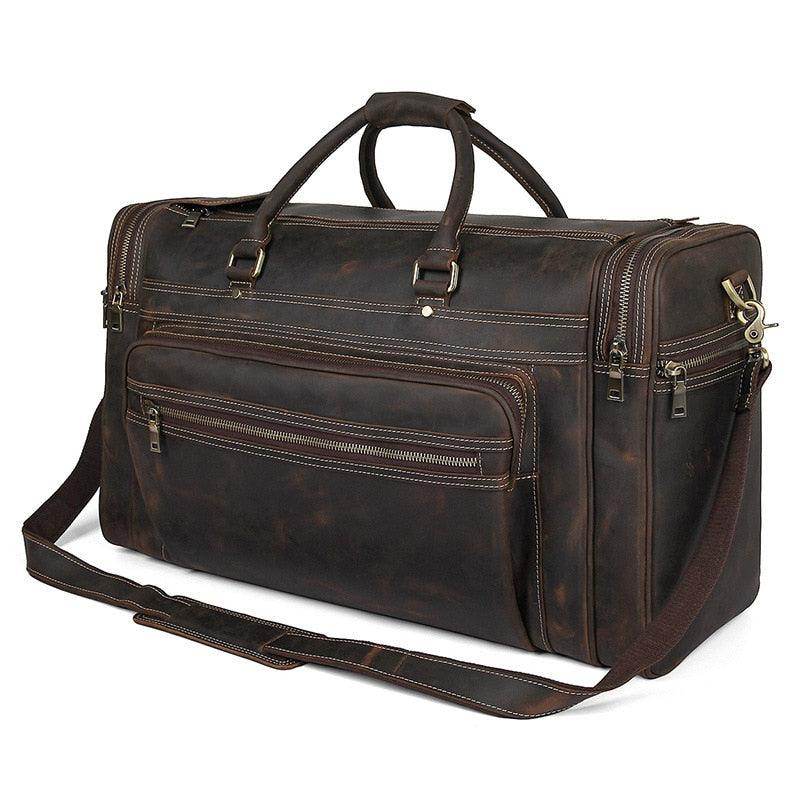Brown leather luggage tote bag with multiple compartments and a detachable shoulder strap