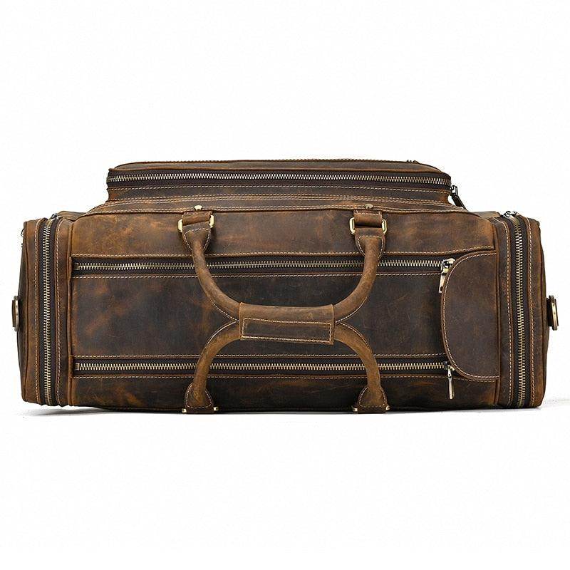 Leather luggage tote bag in dark brown with multiple pockets and sturdy handles for travel convenience