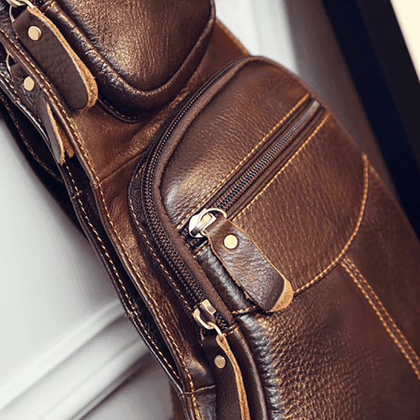 Stylish leather sling bag for travel with multiple pockets and durable design for convenience