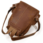 Brown leather travel backpack with adjustable straps and a stylish design for convenient travel