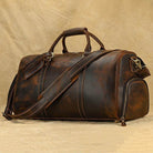Stylish leather weekend bag with shoulder strap in dark brown for travel and gym use