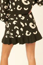 VacationGrabs women's leopard print mini skirt with ruffled hem in black and white pattern