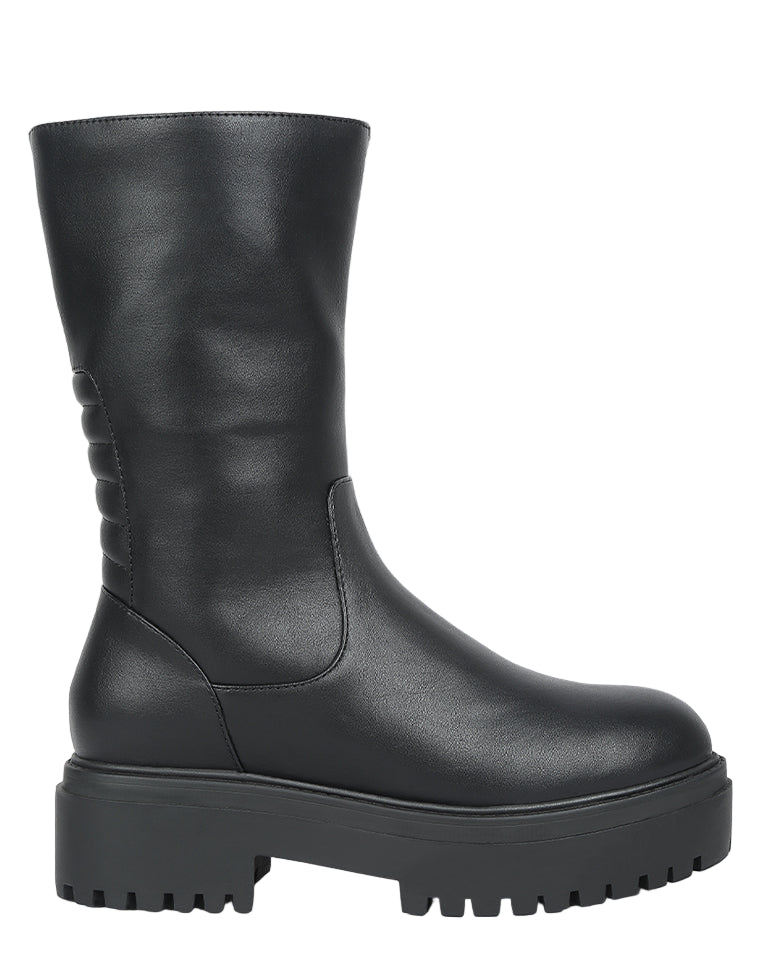 Black leather boot with a thick sole on a light gray background