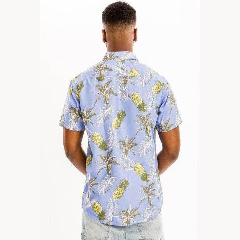 Men's light blue vacation shirt with a tropical pineapple and palm leaf pattern