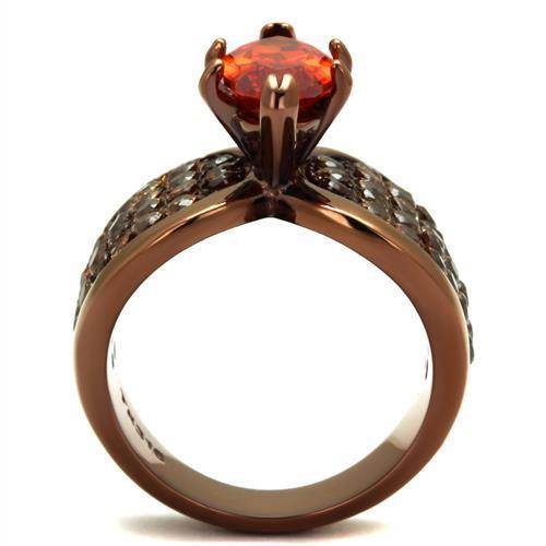 Light brown gemstone statement ring with intricate detailing and a large, vibrant gemstone centerpiece