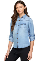 Blue Age lightweight denim shirt for travel worn by woman with rolled sleeves and front pockets