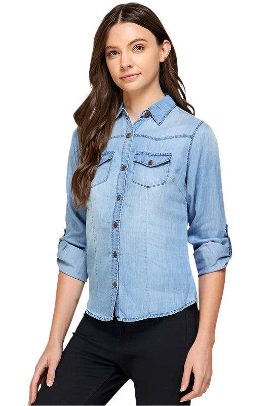 Blue Age lightweight denim shirt for travel worn by woman with rolled sleeves and front pockets