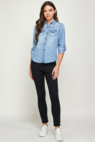 Blue Age lightweight denim shirt for travel worn by woman with rolled sleeves and front pocket