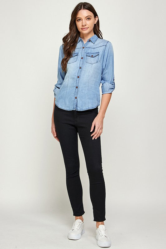 Blue Age lightweight denim shirt for travel worn by woman with rolled sleeves and front pocket