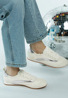 Rag Company lightweight stylish lace up sneakers in white with silver accents worn with blue jeans