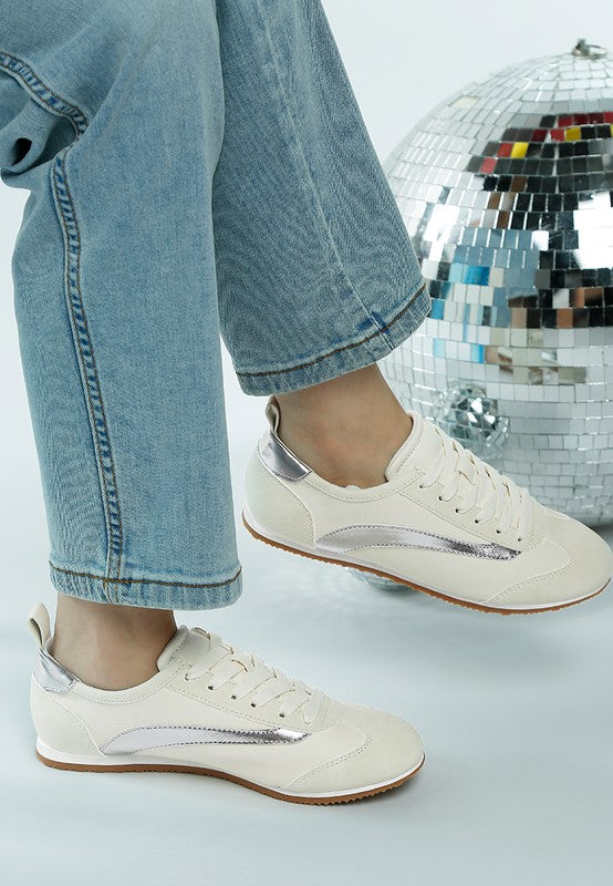Rag Company lightweight stylish lace up sneakers in white with silver accents worn with blue jeans