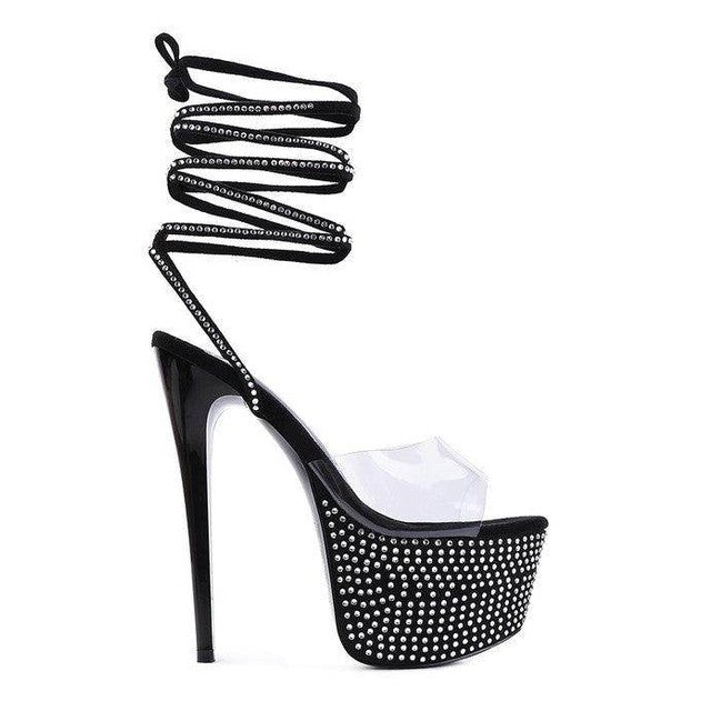 Elegant evening shoes by Rag Company featuring black heels with rhinestone embellishments and a clear platform