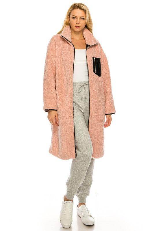 Stylish long pink fleece coat by Andante USA with a cozy oversized design and black pocket