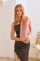 Model showcasing luxury faux fur fashion wrap over a stylish black dress for a chic look