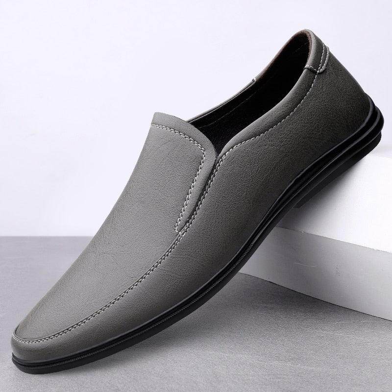 Luxury Italian loafers in grey leather, perfect for stylish and comfortable everyday wear.