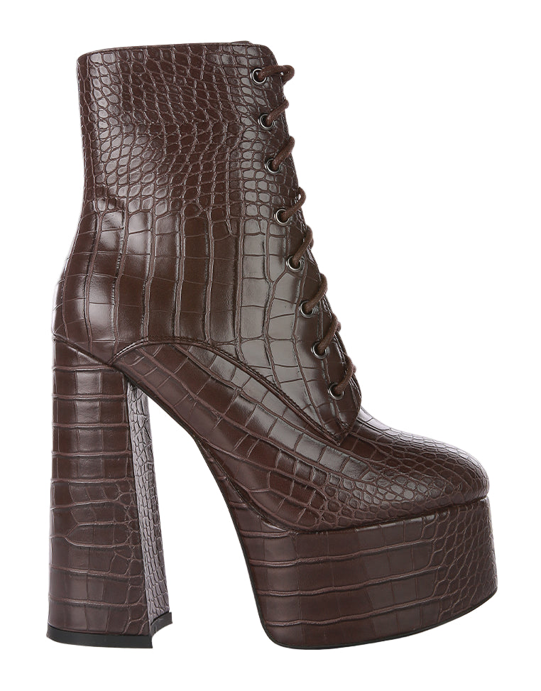 Brown crocodile-patterned platform boot on a white background