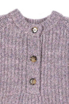 Lilou melange knit sweater featuring textured fabric and decorative buttons on the neckline