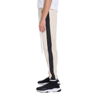 Side view of beige mens jogger sweatpants with black side stripe and zipper pocket