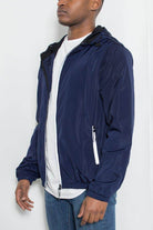 Mens navy blue windbreaker jacket with zip closure and side pockets for casual wear