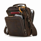 Mens retro leather shoulder bag featuring multiple pockets and an adjustable strap for travel convenience