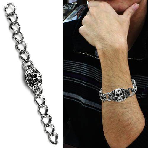 Men's skull bracelet high polished in silver with intricate design worn on arm