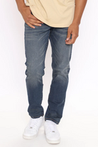 VacationGrabs mens slim fit jeans vintage blue worn with white sneakers and beige shirt