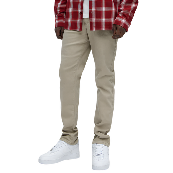 VacationGrabs mens slim fit khaki jeans worn with white sneakers and a red plaid shirt