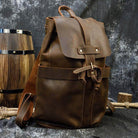 Mens vintage leather backpack with adjustable straps and spacious main compartment for travel and outdoor use