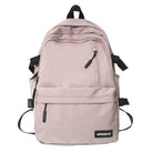 Pink nylon backpack for travel with multiple pockets and adjustable straps for comfort