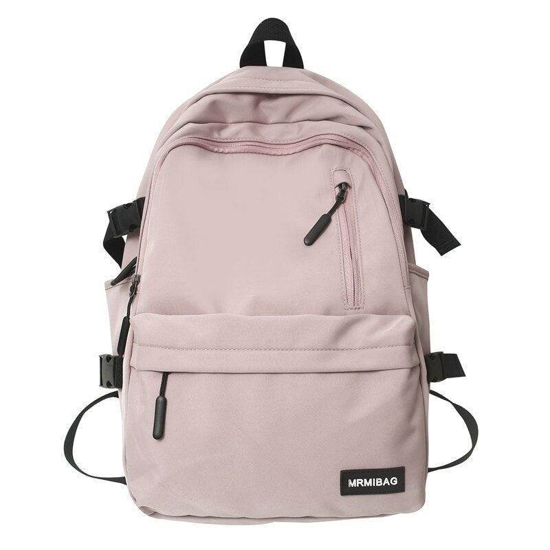 Pink nylon backpack for travel with multiple pockets and adjustable straps for comfort