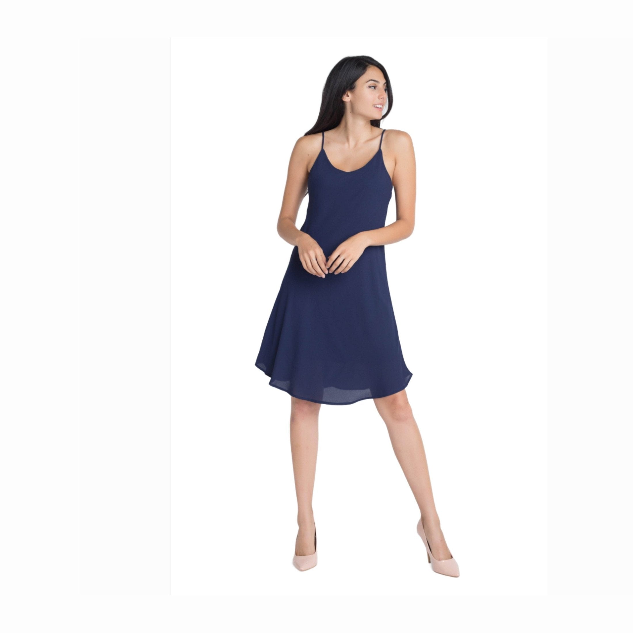 Ivory Felix navy blue flowy dress with adjustable straps and a graceful hemlin
