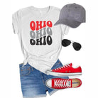 Ocean and 7th Ohio vacation shirt in gray and red paired with denim shorts and accessories
