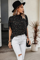 Stylish black open back summer tops for women with a relaxed fit, perfect for casual outings