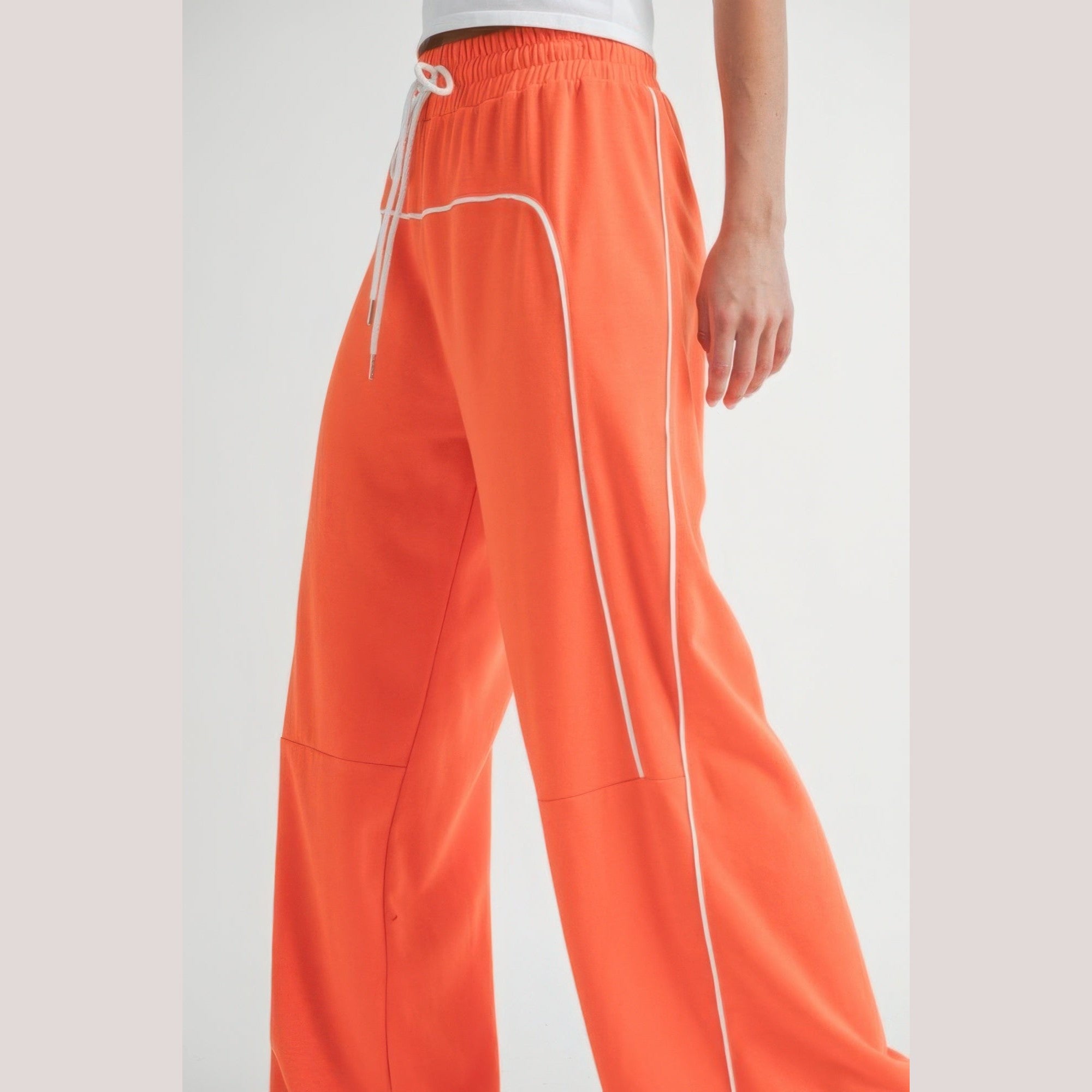 VacationGrabs women's orange drawstring pants with white piping and relaxed fit