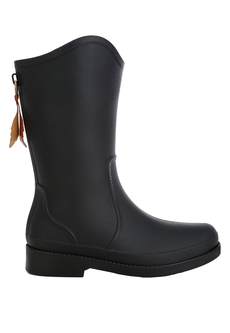 Black rain boot on a white background