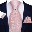 Elegant pink paisley necktie for weddings paired with matching pocket square and cufflinks