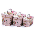 Paris themed cosmetic case set in pink with floral design and metal handles, perfect for travel toiletries