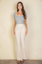 VacationGrabs women's pink flare trousers for women styled with a striped top and sandals