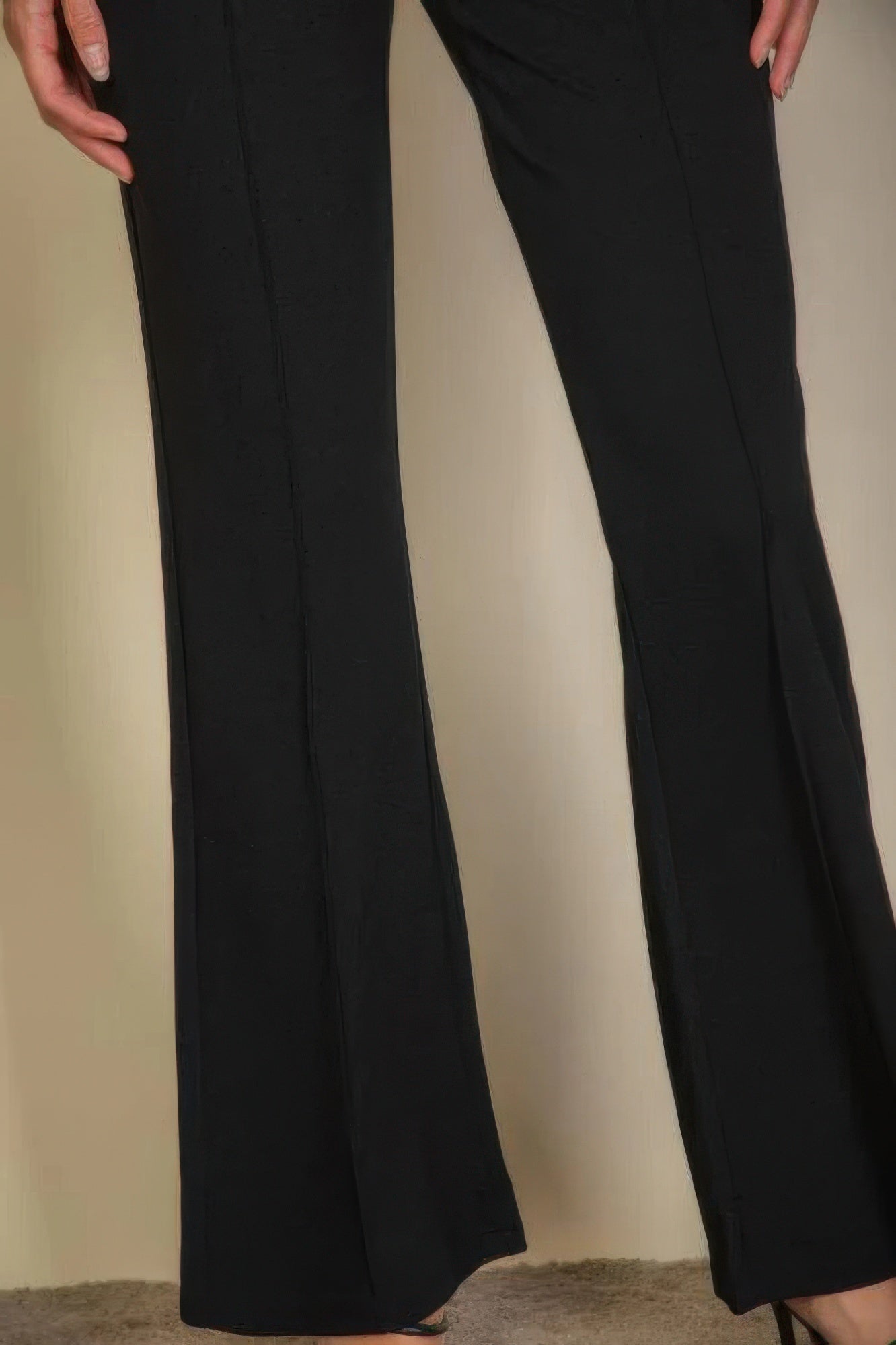 Black flare trousers for women showing wide leg design from VacationGrabs