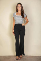 VacationGrabs black flare trousers for women styled with striped top and sandals